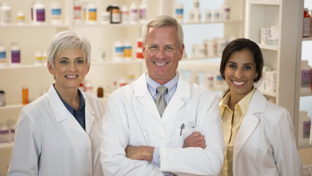 Portrait of three pharmacist.