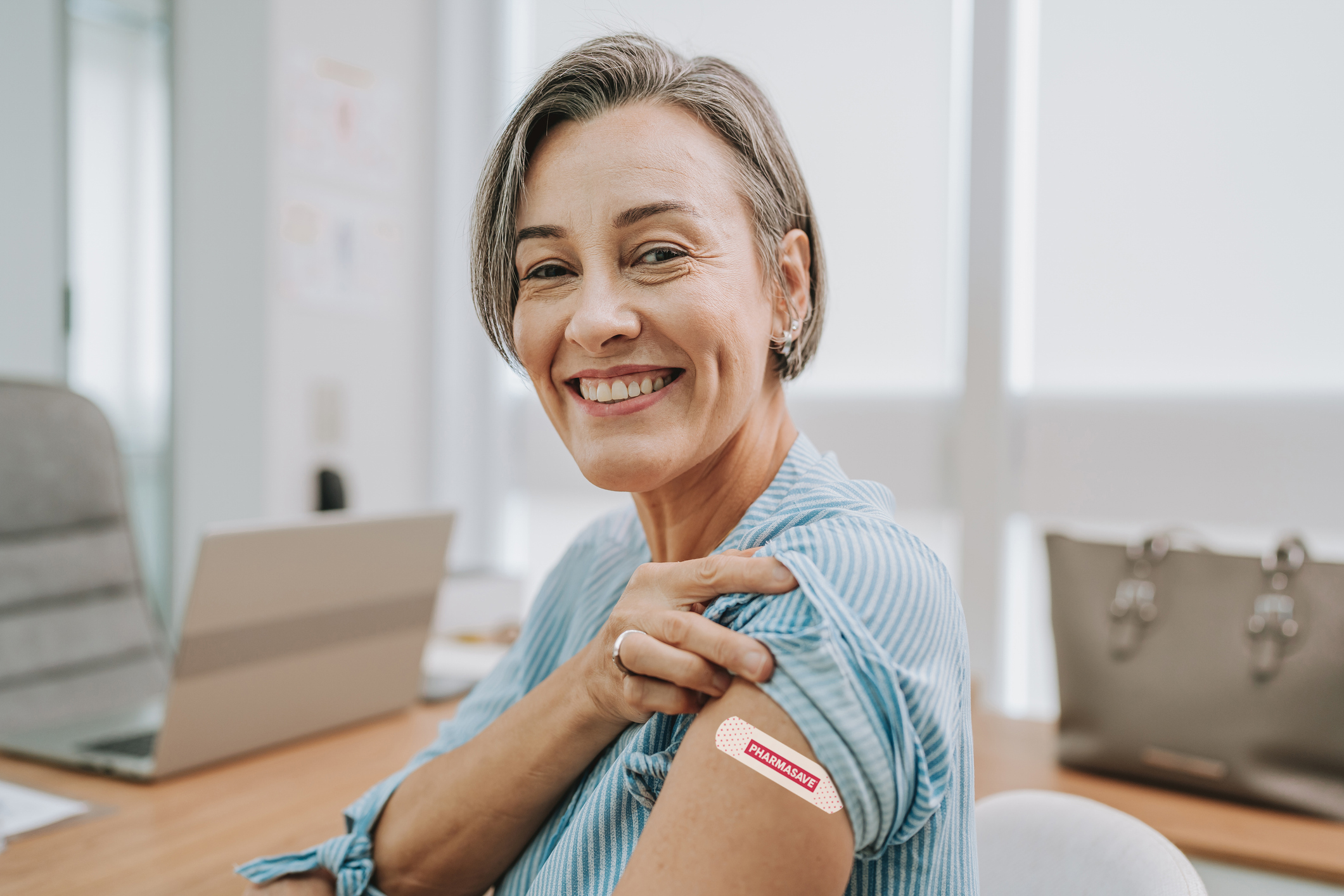 Woman showing vaccinated arm